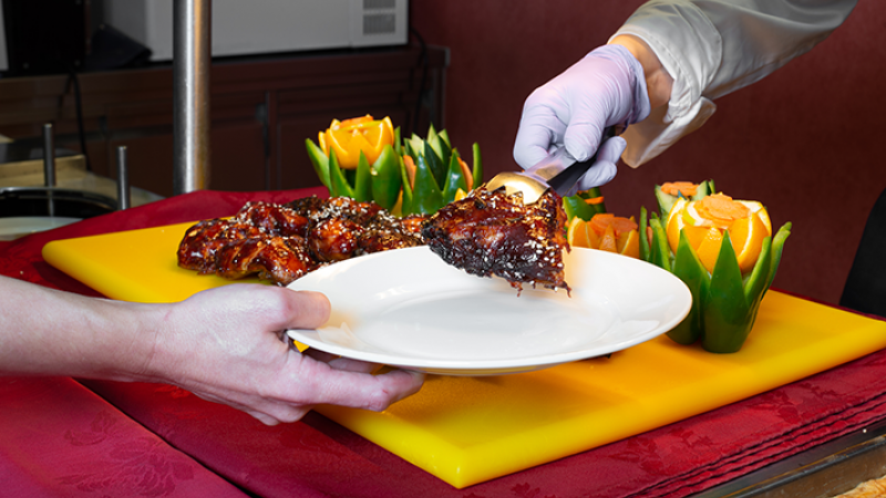 Offshore worker being served food